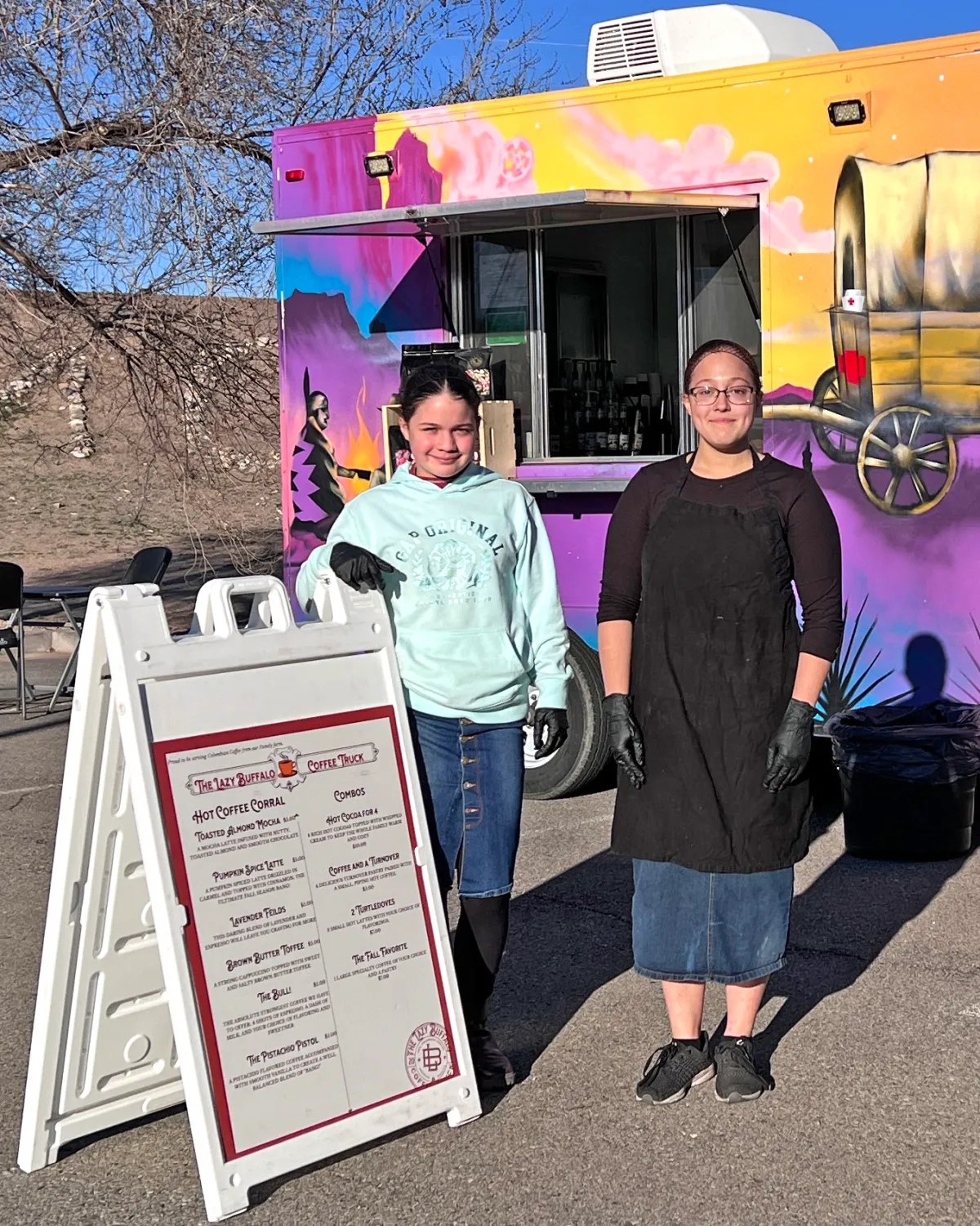 The Lazy Buffalo coffee truck, hand-painted with a bison mural, with staff out front